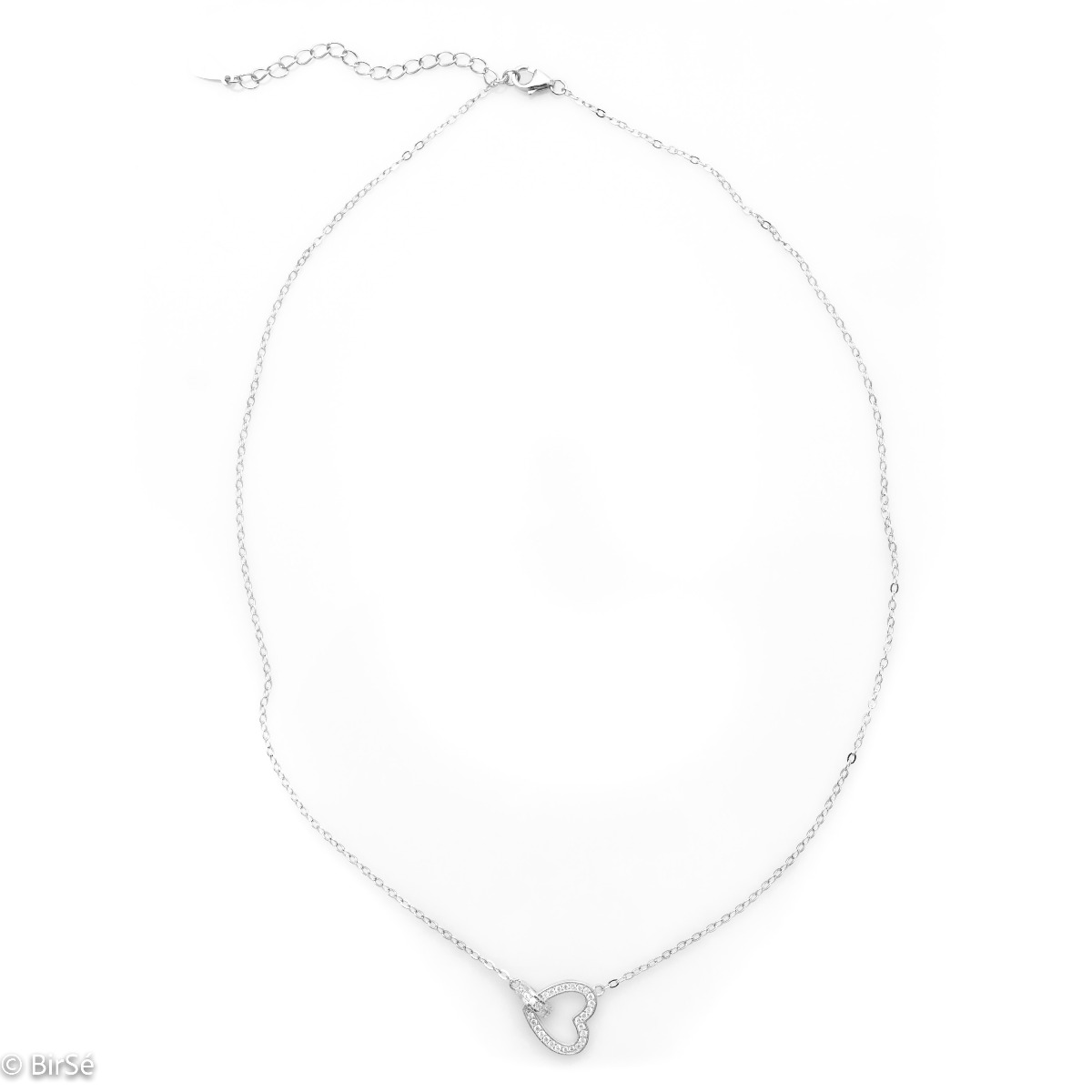 A stylish necklace in soft rhodium silver with an asymmetrically placed dainty heart, all encrusted with sparkling zircons.