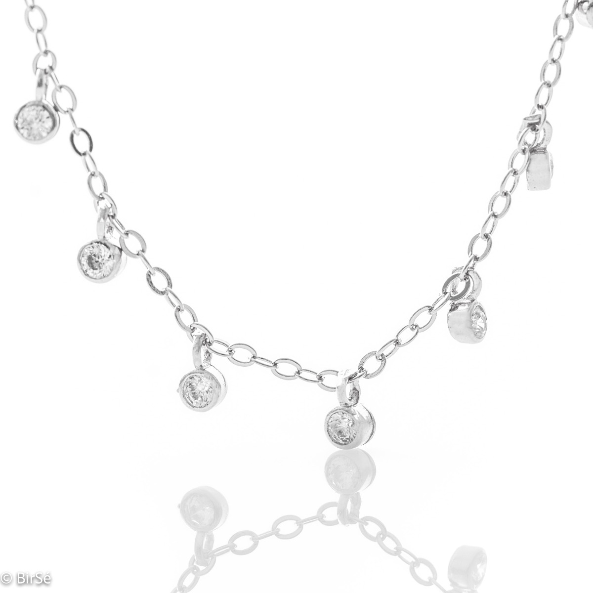 Stylish women's necklace in fine rhodium silver with pendants of sparkling zircons. The model is suitable for both official events in your life and for everyday life.