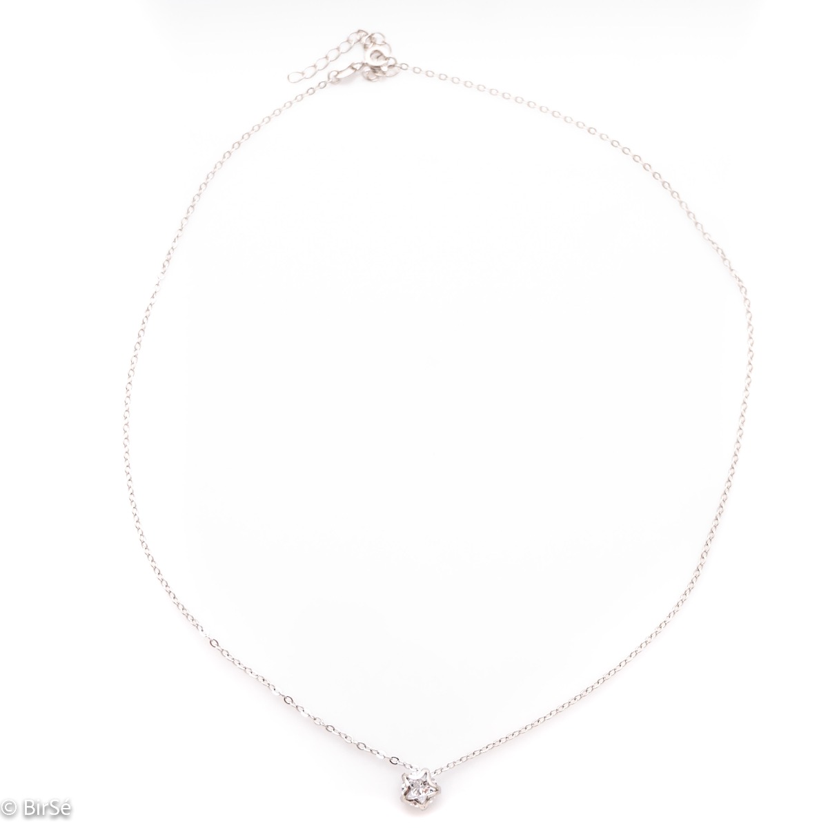 Fine women's necklace of soft rhodium silver and a beautiful round zircon, elegantly covered on both sides with silver stars. The necklace has an extension of the chain, for greater convenience.