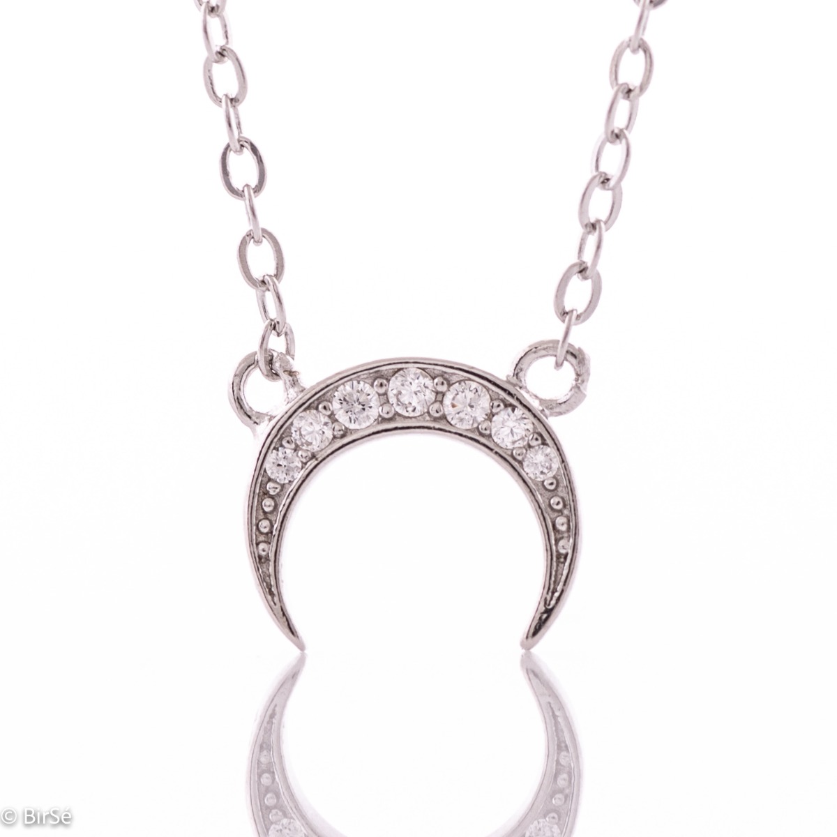 The indescribable beauty of the Moon, collected in a delicate necklace of rhodium-plated silver, with masterfully shaped elements, spectacularly combined with the enchanting shine of zircons. Touch the moon with the new jewelry from BirSe.