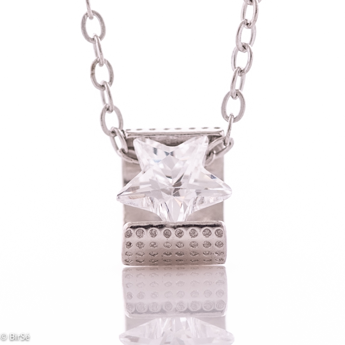 An elegant silver necklace with an accent of spectacularly shaped zircon - star. The stylish composition, made entirely of soft rhodium-plated silver, enhanced by the shine of the zircon, turns the jewelry into an elegant and stylish gift.