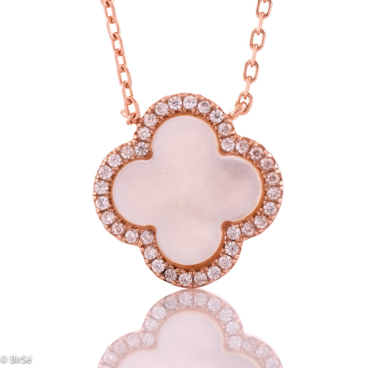 Stylish women's clover shaped necklace in classic rhodium-plated silver and beautiful white mother-of-pearl. A row of dazzling zircons encircles the delicate clover. Suitable jewelry for your everyday life in the office or in nature.