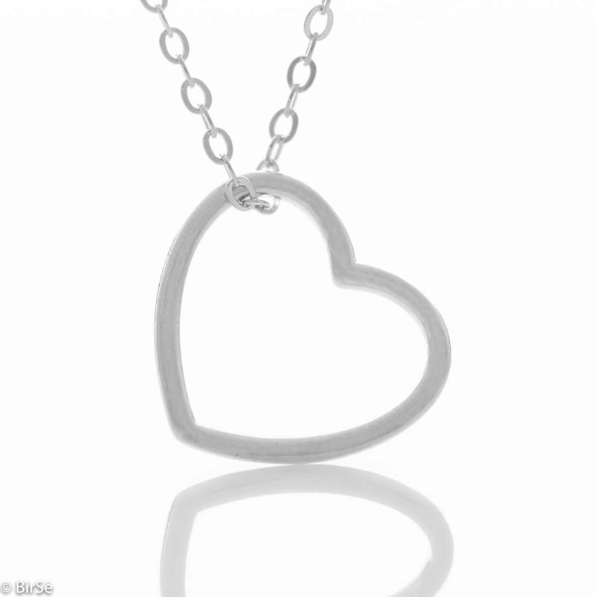 Exquisite workmanship of a necklace with a fine rhodium-plated silver heart. Simple jewelry for elegant ladies with style. All jewelry is gift-wrapped and accompanied by a certificate of quality and warranty.