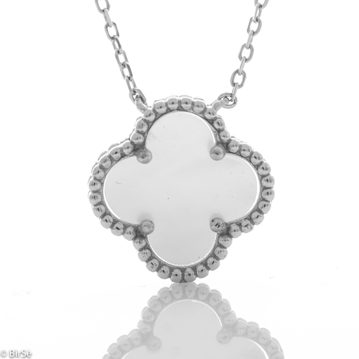 Fine silver Van Cleef model necklace. A beautifully crafted piece of rhodium-plated silver, gently envelops a fine mother-of-pearl in the shape of a four-leaf clover. The chain is delicate, with an extender to be worn according to the lady's preference.