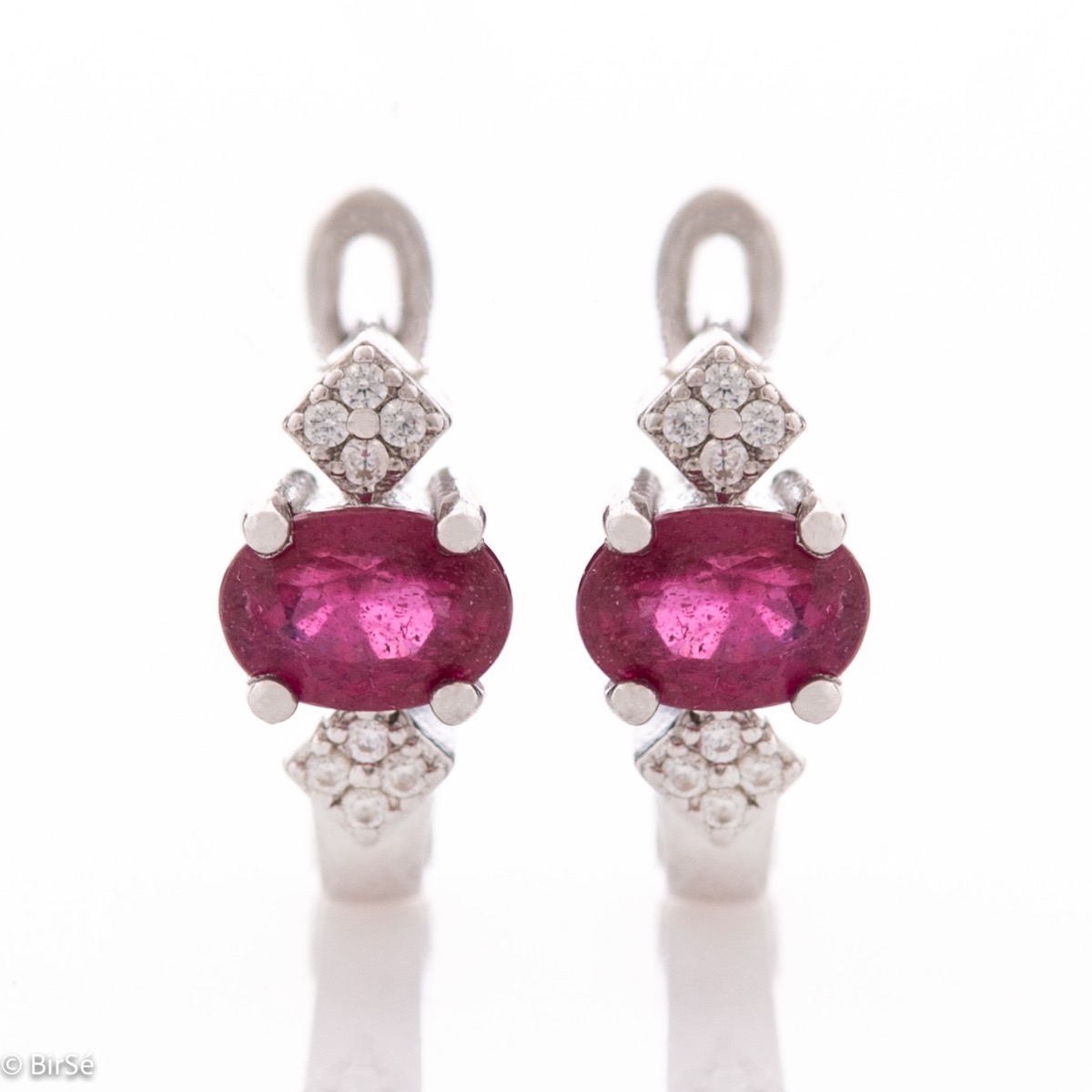 Exclusive women's earrings with English clasp and an exquisite combination of radiant natural ruby ​​with soft rhodium silver and sparkling zircons.