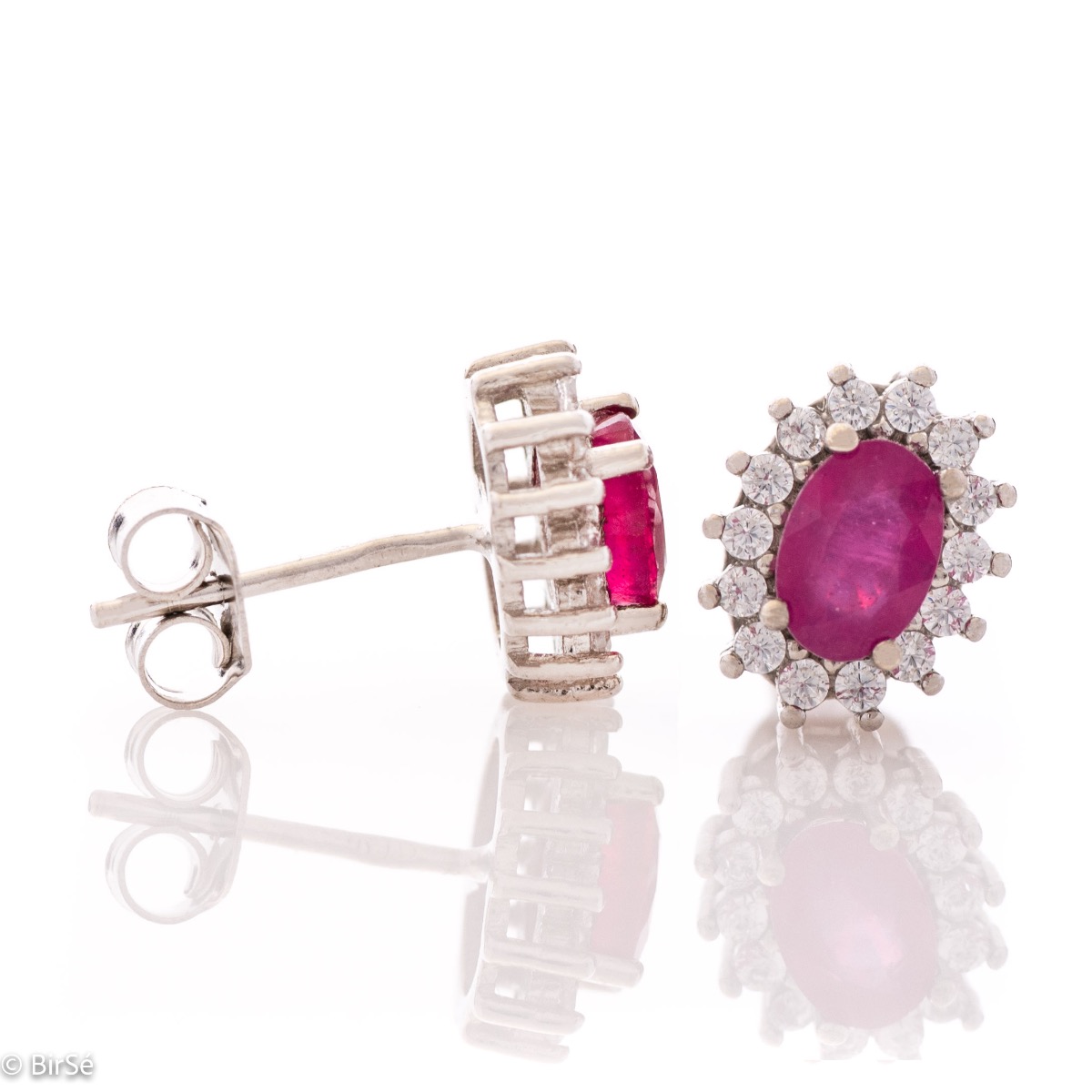 Delicate and radiant women's stud earrings with exquisite workmanship combining a unique natural ruby, surrounded by sparkling zircons, with rhodium-plated silver. They can be combined with a ring, necklace and bracelet of the same model.