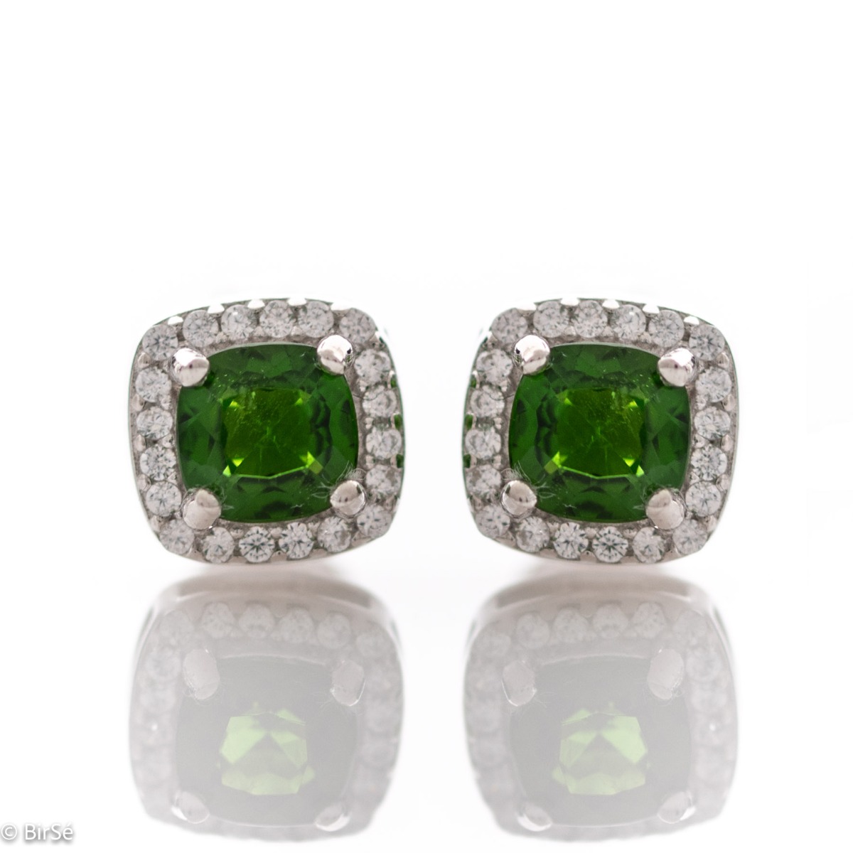 Finely crafted rhodium silver stud earrings with stunning natural chrome diopside in the center surrounded by sparkling cubic zirconias. Can be combined with a ring and pendant from the set.