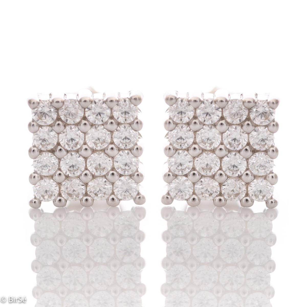 Captivating "Finesse" earrings with a charming square design in rhodium silver, elegantly embellished with cubic zirconias. Pin fastening for convenience and security. Suitable for formal and casual outfits.