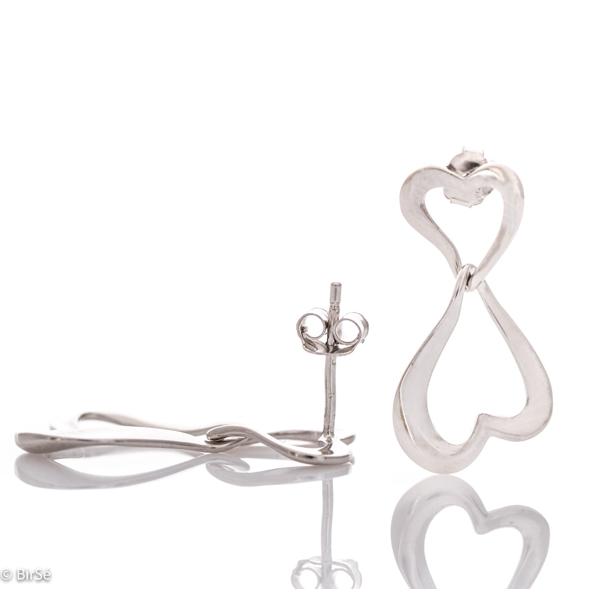 Exquisitely crafted, our new drop stud earrings feature a stylish design featuring two rhodium-plated silver hearts elegantly entwined in a charming embrace.