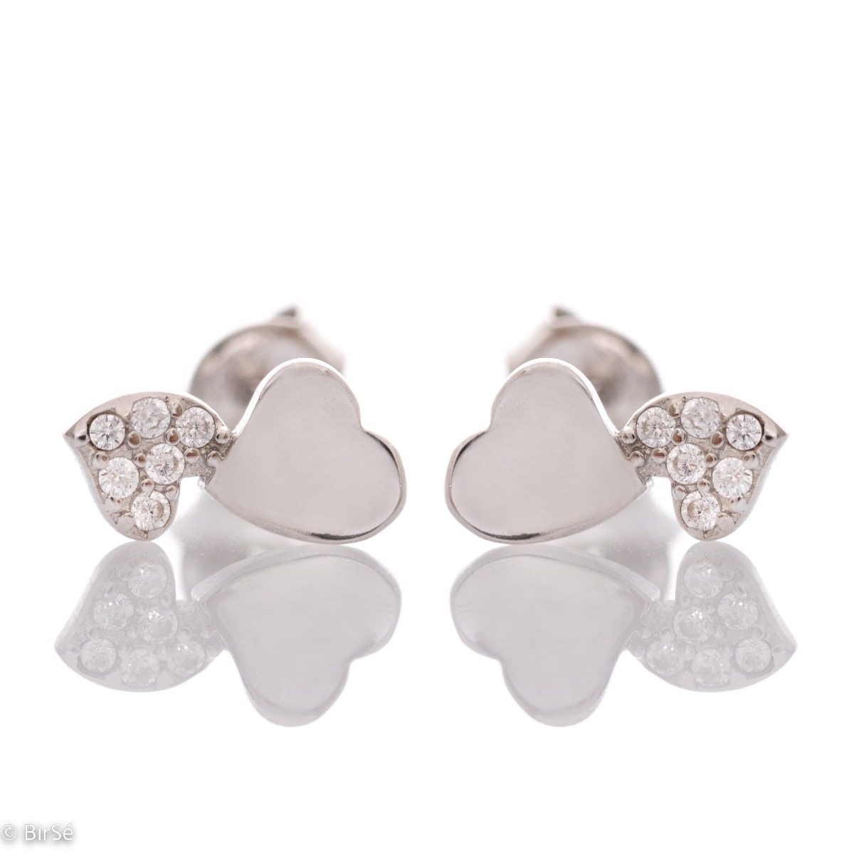 Exquisite earrings made of fine silver in the shape of a heart, in a delicate combination with sparkling zircons. Fastening with a pin is for more convenience, and the earrings are a suitable gift for the beloved girl