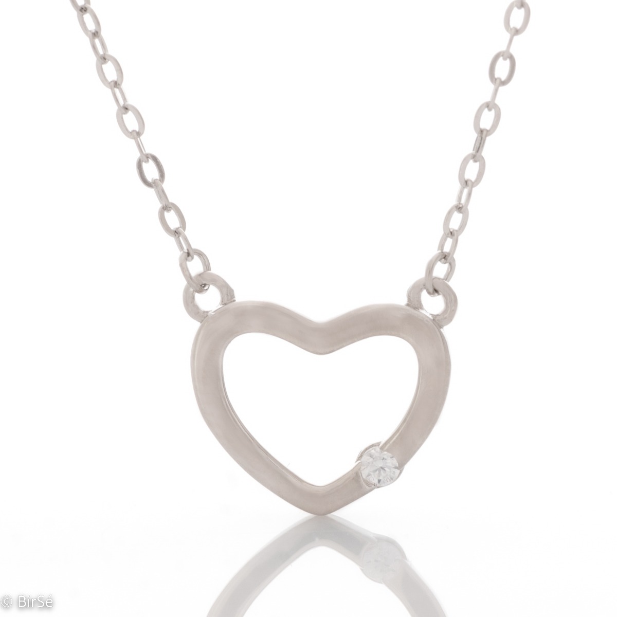 Delicate women's necklace with a charming design in rhodium silver. The piece features a delicate classic braided chain that holds a dainty heart with a dazzling cubic zirconia.