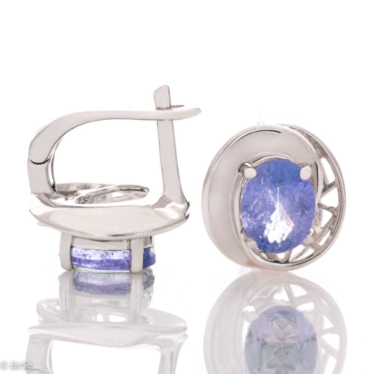 Sophisticated ladies' earrings, beautifully crafted from rhodium-plated silver, wrapped in a gentle embrace of enchanted tanzanite. Can be combined with a ring and pendant from the same collection.