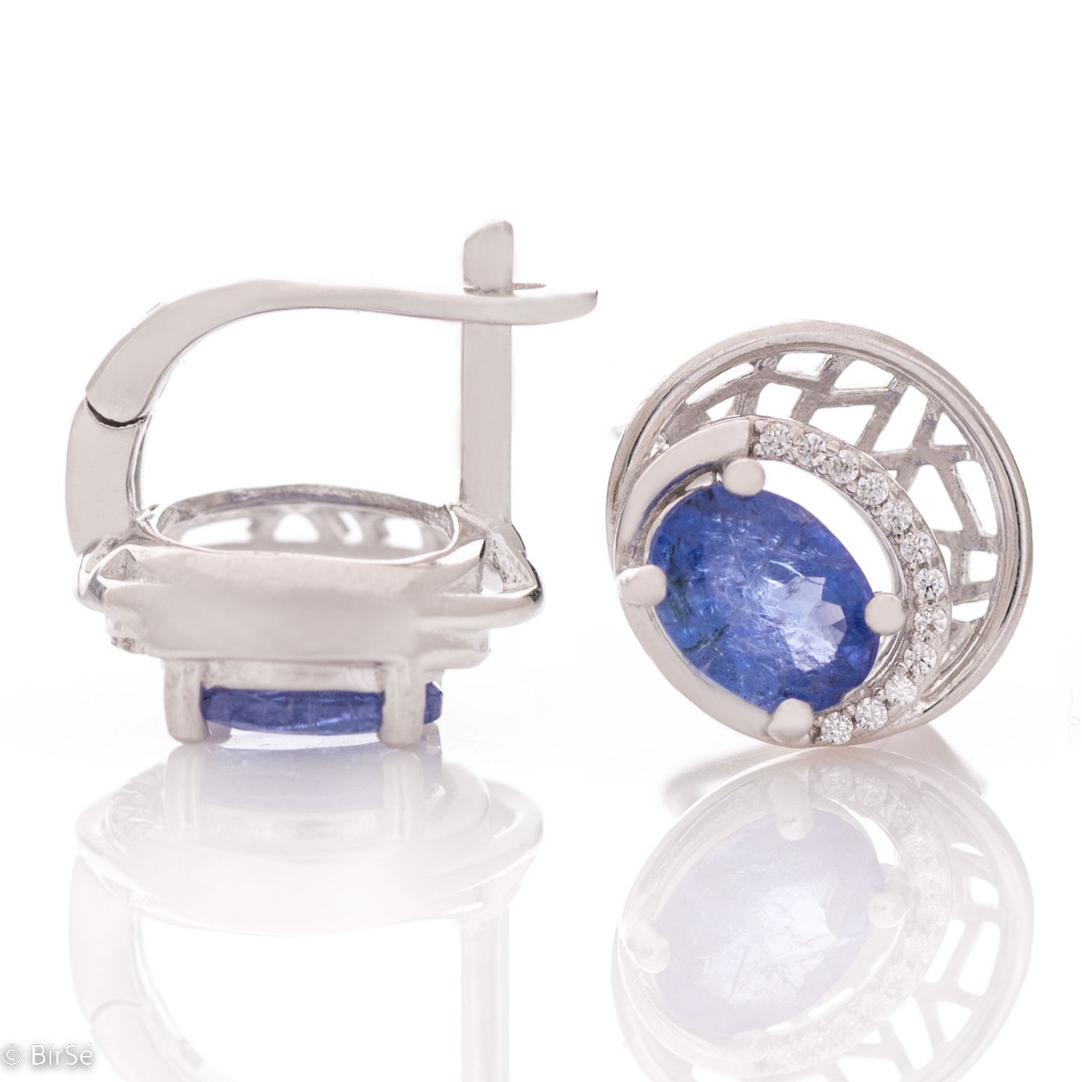 Elegant silver earrings with a modern look and English clasp. Stylish designer craftsmanship from a fine combination of rhodium-plated silver with captivating natural tanzanite. Complete with silver pendant and silver ring from the same collection.