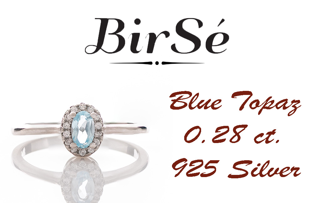 An exquisite women's ring with a tempting natural blue topaz, complemented by the sparkle of fine cubic zirconias and beautifully crafted entirely in rhodium-plated silver. In a charming set with matching earrings, bracelet and necklace.