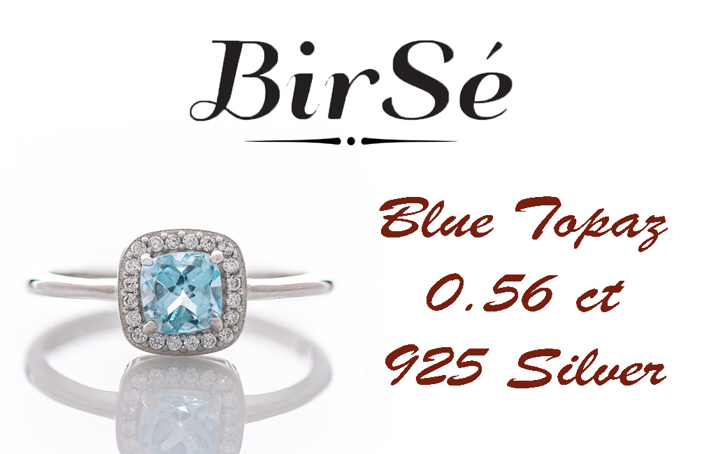 Tempting ring of rhodium-plated silver and natural blue topaz in the exquisite embrace of zircon stones.