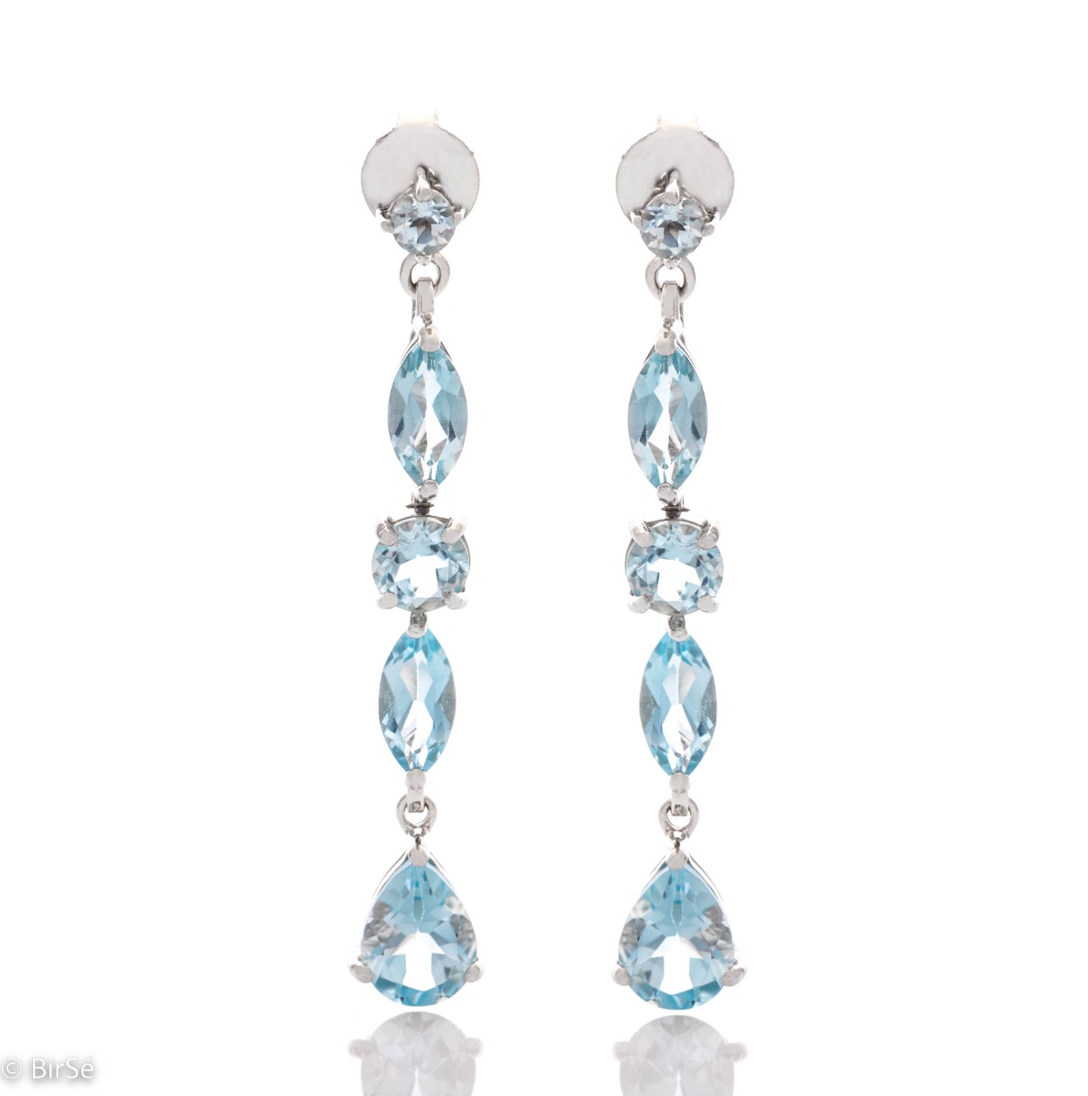 Exquisite earrings that will add sparkle to any look! Irresistible dangle earrings are made of soft rhodium silver and sparkling natural topaz, in a sky blue color.