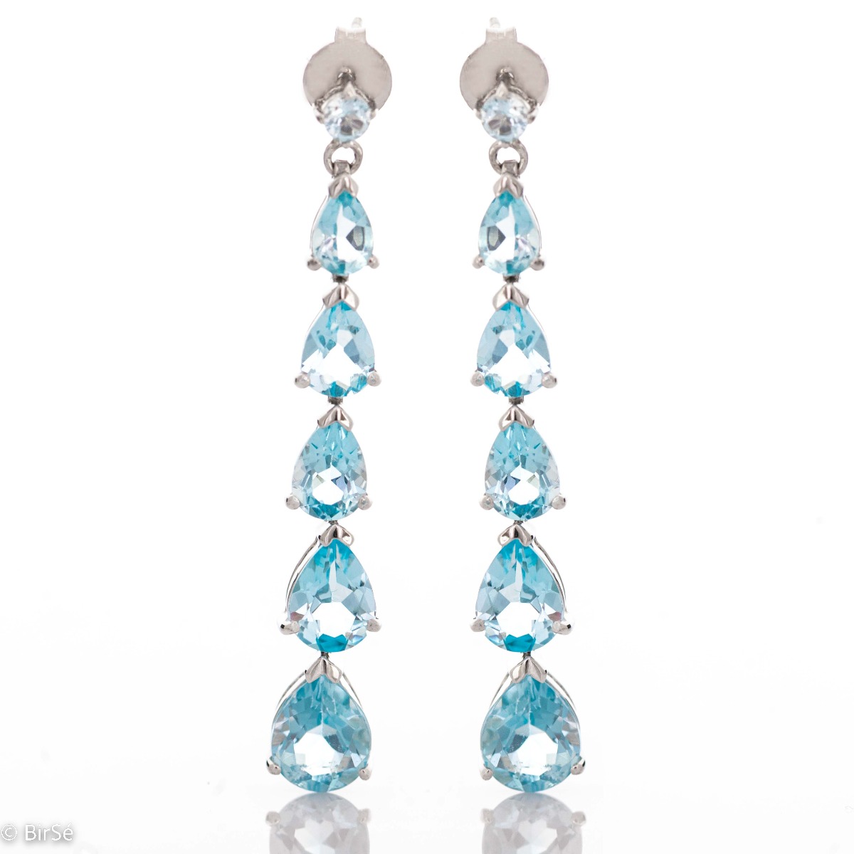 Captivating dangling silver earrings with natural blue topaz, whose magic will transport you to an unforgettable sea tale. Eye-catching, with a pin fastening, they can be worn for any formal occasion or just for a summer mood.