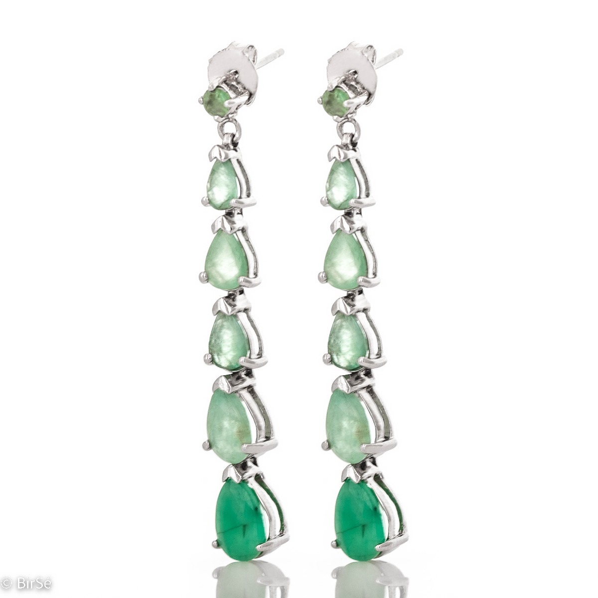 Add a delicate touch of elegance with sterling silver earrings set with a natural emerald. Eye-catching, with a pin fastening, they can be worn for any formal occasion or just for a summer mood.