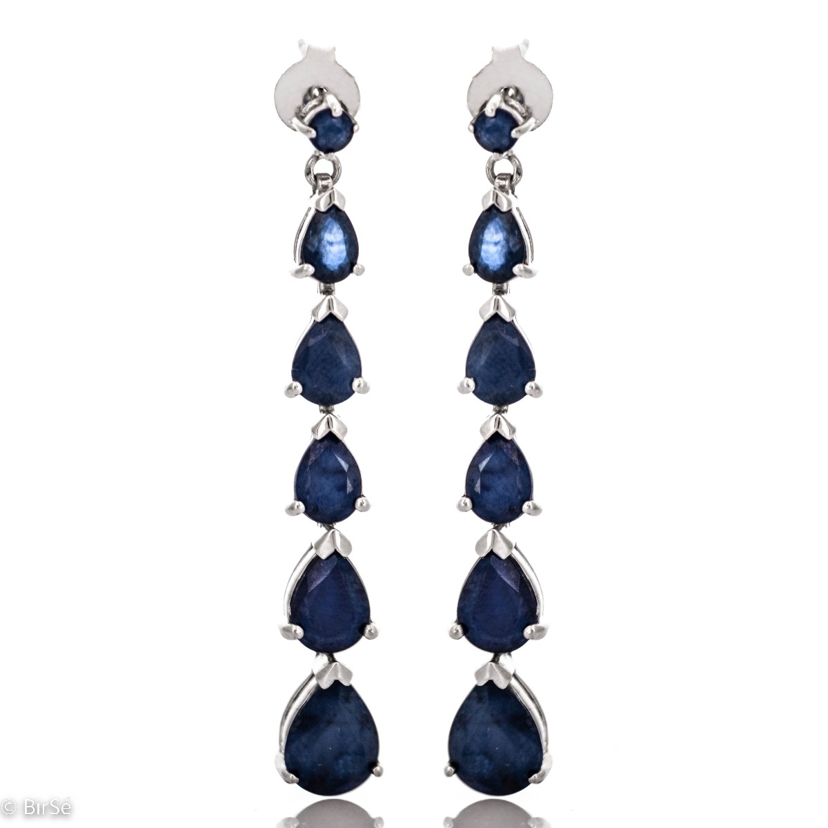 Beautiful and dazzling, rhodium silver and natural teardrop sapphire earrings will add sophisticated style to your look.