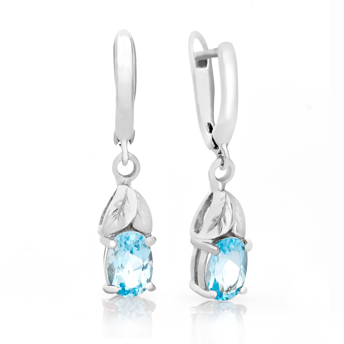 Beautiful dangle earrings for women with English clasp and delicate floral elements, combining natural sky blue topaz with exquisite and fine craftsmanship in rhodium silver. Combines perfectly with a ring and pendant from the model.