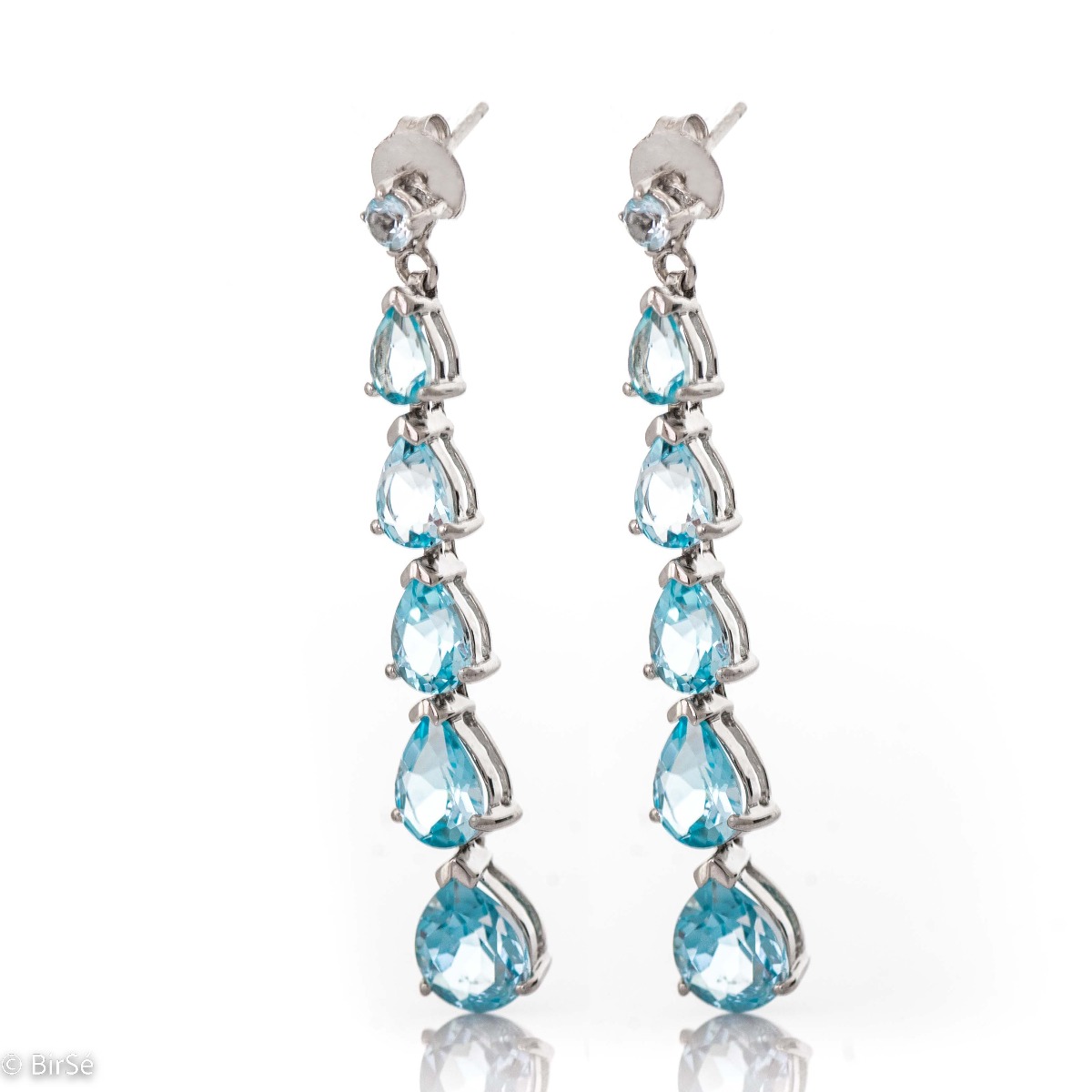 Captivating dangling silver earrings with natural blue topaz, whose magic will transport you to an unforgettable sea tale. Eye-catching, with a pin fastening, they can be worn for any formal occasion or just for a summer mood.