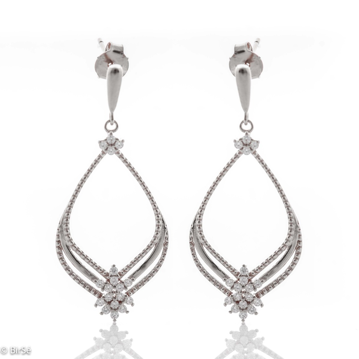 Silver earrings "Magic" - an extremely beautiful piece of jewelry. Made entirely of rhodium-plated silver, with fine elements and added zircons for even more opulence. Pin fastening is convenient and secure for ladies.