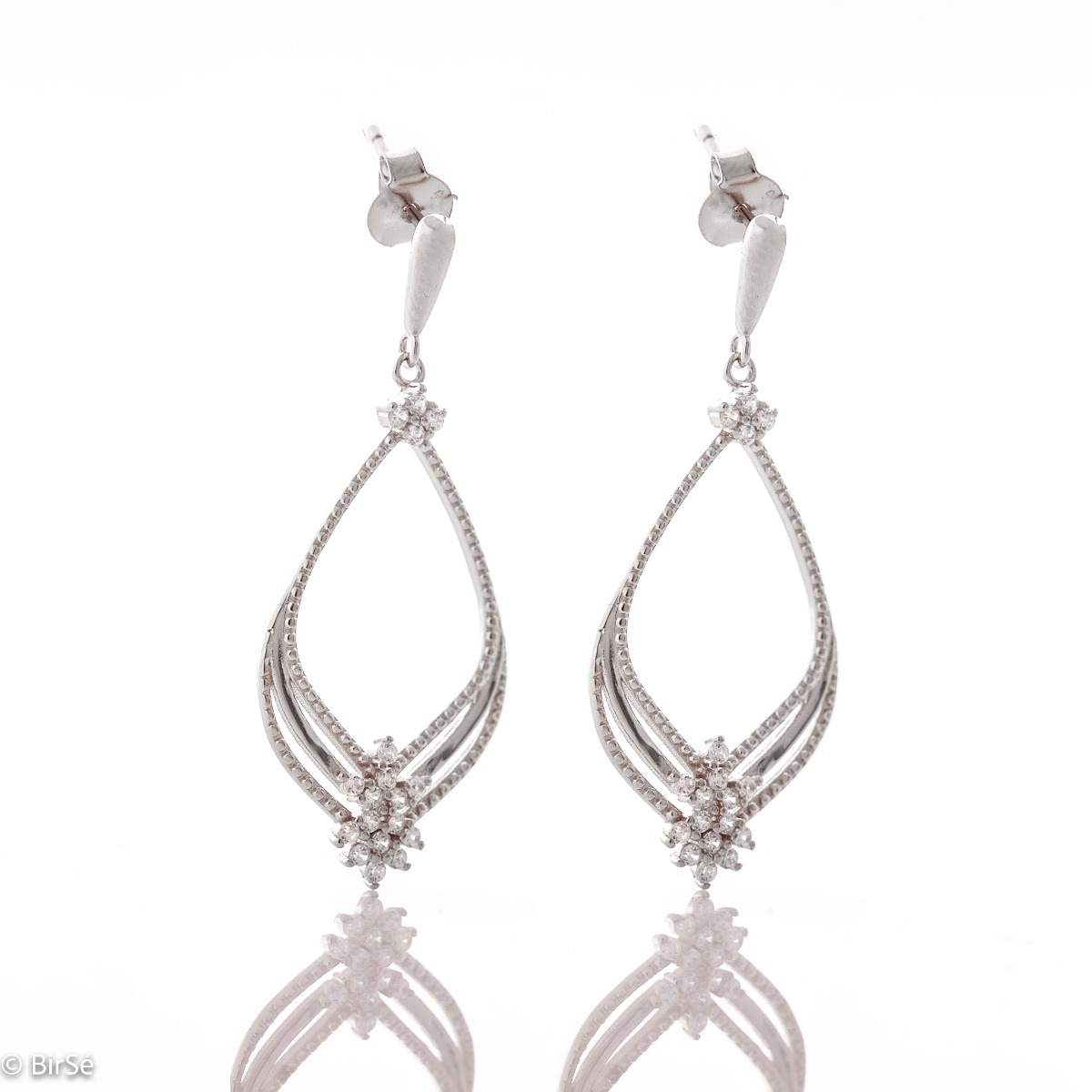 Silver earrings "Magic" - an extremely beautiful piece of jewelry. Made entirely of rhodium-plated silver, with fine elements and added zircons for even more opulence. Pin fastening is convenient and secure for ladies.