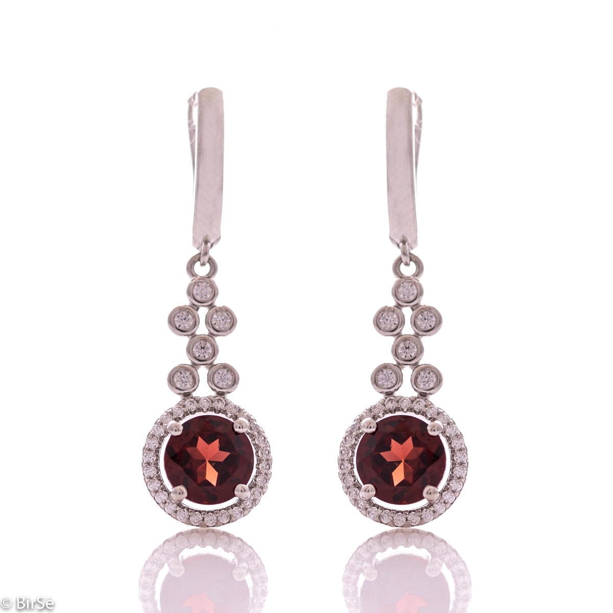 Women's dangle earrings with English clasp and precision craftsmanship entirely in rhodium-plated silver, combined with radiant natural garnet and sparkling zircons. They can be combined with a ring and pendant of the same model.