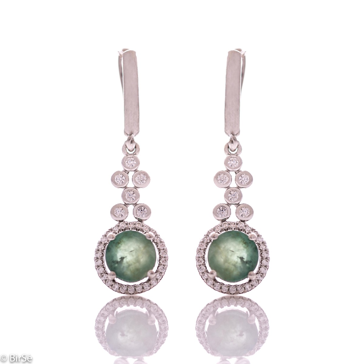 Women's dangling earrings with English clasp and precision craftsmanship entirely in rhodium-plated silver, combined with a radiant natural emerald and sparkling zircons. They can be combined with a ring and pendant of the same model.