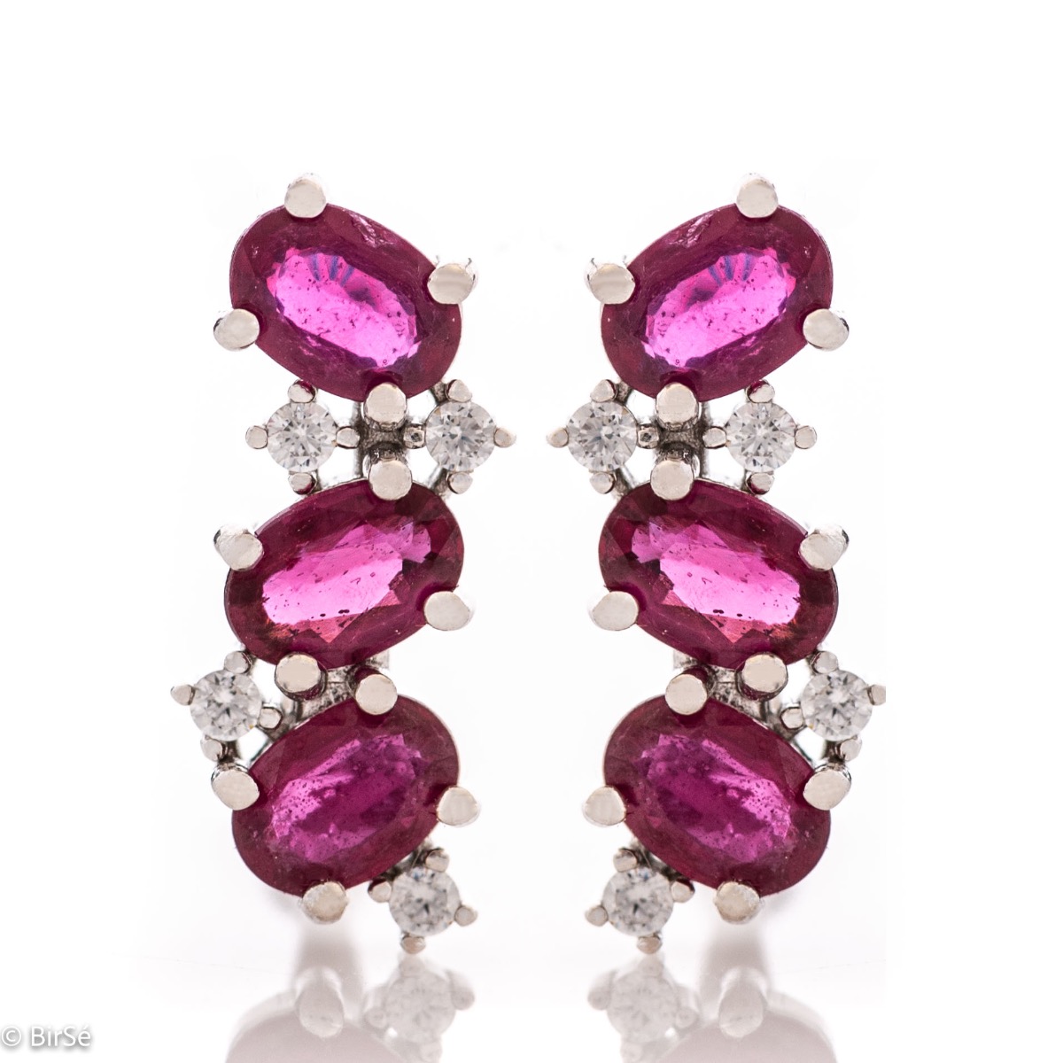 Exquisite craftsmanship of our new English clasp earrings in a beautiful shape and curves, combining numerous and different natural ruby ​​stones, surrounding delicate zircons.