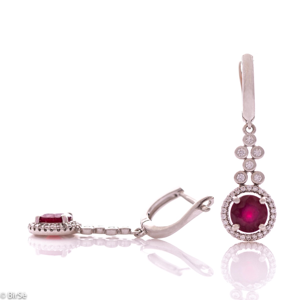 Women's dangling earrings with English clasp and precision craftsmanship entirely in rhodium-plated silver, combined with a radiant natural ruby ​​and sparkling zircons. They can be combined with a ring and pendant of the same model.