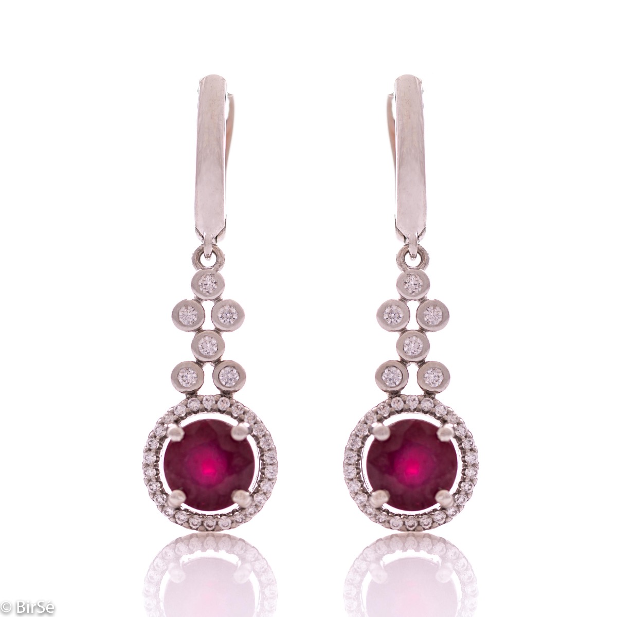 Women's dangling earrings with English clasp and precision craftsmanship entirely in rhodium-plated silver, combined with a radiant natural ruby ​​and sparkling zircons. They can be combined with a ring and pendant of the same model.